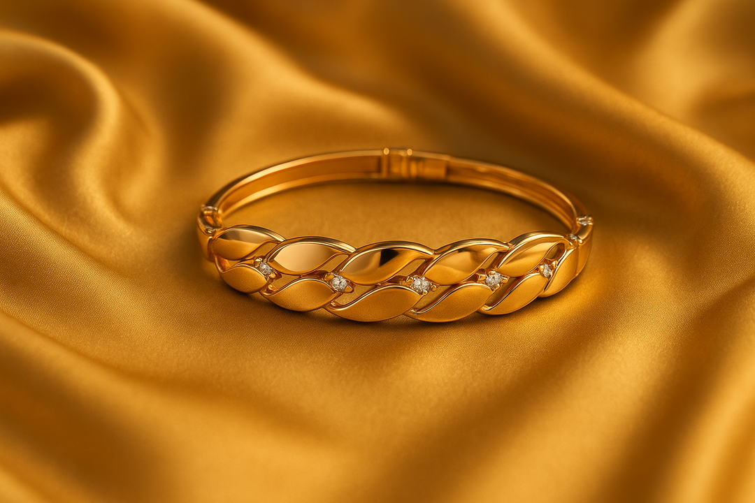 Elegant Gold-Tone Designer Bracelet with Marquise Links & Sparkling Stones by Rivyah